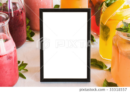 Blank picture frame with fresh fruit drinks around 33318557