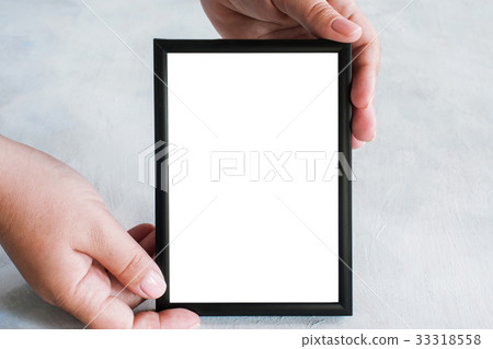 Picture frame tenderly holding in hands Picture frame tenderly holding in hands 33318558