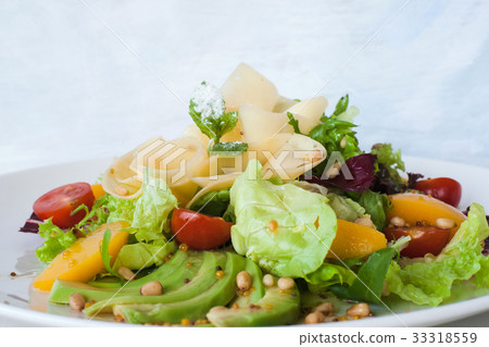 Tasty green salad with cheese and fruits Tasty green salad with cheese and fruits 33318559