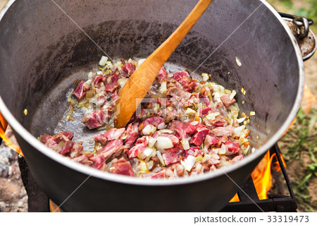 Traditional cooking in nature. Cauldron on fire Traditional cooking in nature. Cauldron on fire 33319473