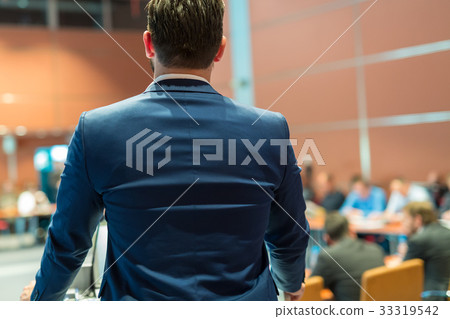 Public speaker giving talk at Business Event. 33319542