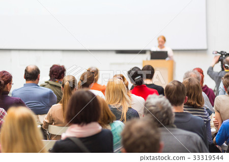 Woman giving presentation on business conference. Woman giving presentation on business conference. 33319544
