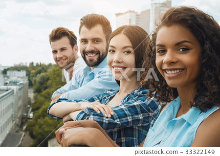 Group of friends having barbecue party on the roof 33322149