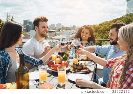 Group of friends having barbecue party on the roof 33322152