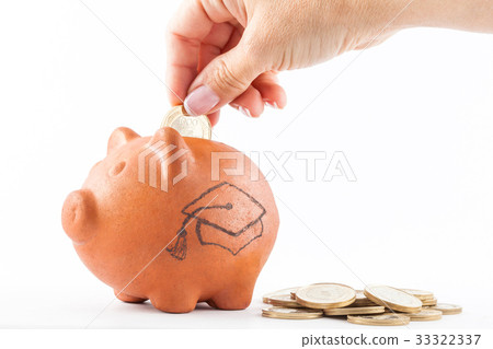 Woman saving money into a traditional clay piggy 33322337