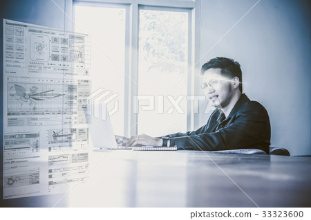 Happy asian businessman sitting on working space and using laptop and showing technology digital virtual screen on the working space in modern meeting room. business innovation concept Happy asian businessman sitting on working space and using laptop and showing technology digital virtual screen on the working space in modern meeting room. business innovation concept 33323600