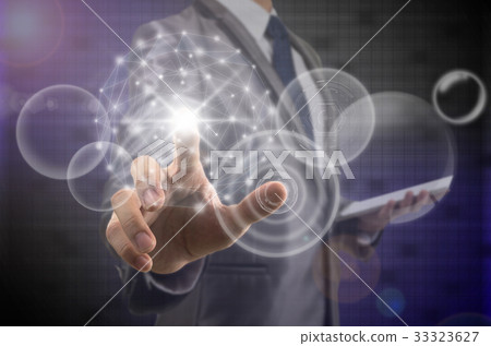 Businessman pointing the modern virtual screen over the photo blurred background, business and technology concept Businessman pointing the modern virtual screen over the photo blurred background, business and technology concept 33323627