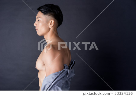 A portrait of sexy man with strong muscle and his shirt A portrait of sexy man with strong muscle and his shirt 33324136