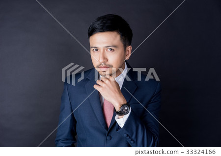 A portrait of handsome businessman wearing suit and thinking 33324166