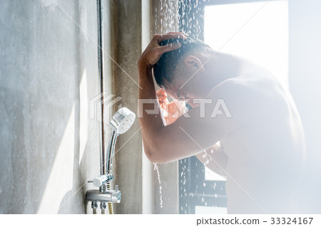A photo of a strong man taking shower in the bathroom A photo of a strong man taking shower in the bathroom 33324167
