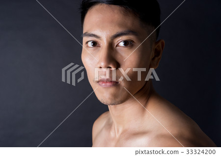 The portrait of a man's face on black background The portrait of a man's face on black background 33324200