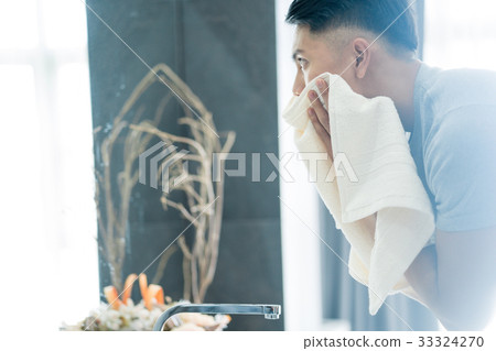a photo of a man cleaning his face a photo of a man cleaning his face 33324270