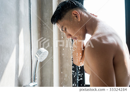 a picture of a man taking a shower in the bathroom 33324284