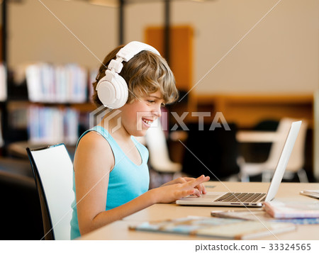 Boy spending time with notebook Boy spending time with notebook 33324565