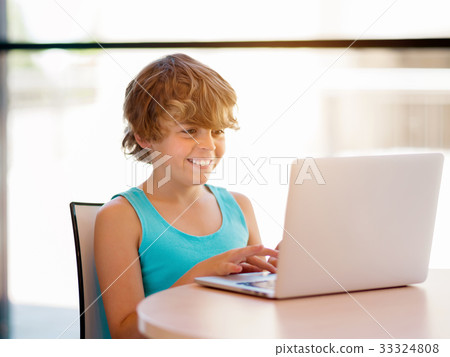 Little boy with laptop 33324808
