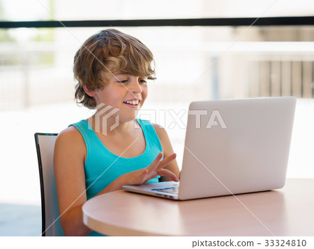 Little boy with laptop 33324810