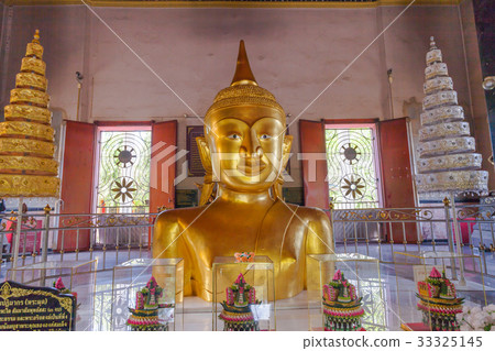 a golden Buddha image interred up to the cheat  33325145