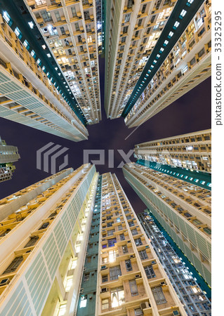 Skyscraper building from low angle at night 33325295