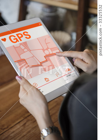 Hands working on digital device network graphic overlay Hands working on digital device network graphic overlay 33325532