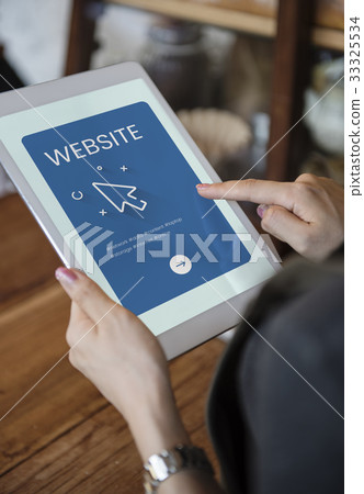 Hands working on digital device network graphic overlay 33325534