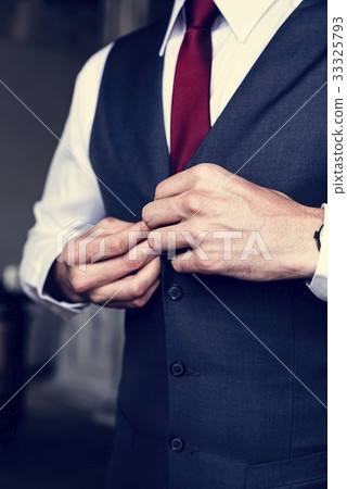 Handsome Groom Dressing Up for Wedding Ceremony 33325793