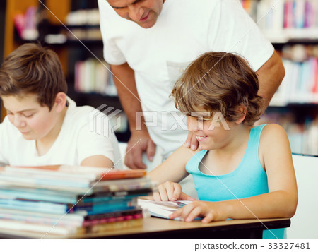 Two boys in library 33327481