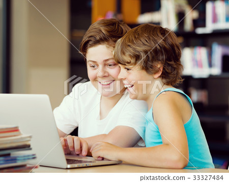 Two boys in library Two boys in library 33327484