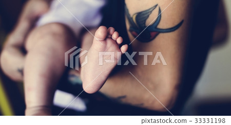 Father is taking care of his son. 33331198