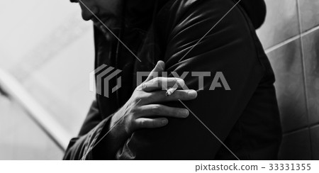 A lonely suffering man smoking A lonely suffering man smoking 33331355