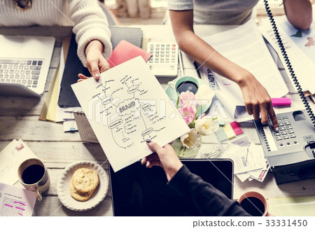 Colleagues Handing Branding Plan Strategy to other Colleagues Handing Branding Plan Strategy to other 33331450