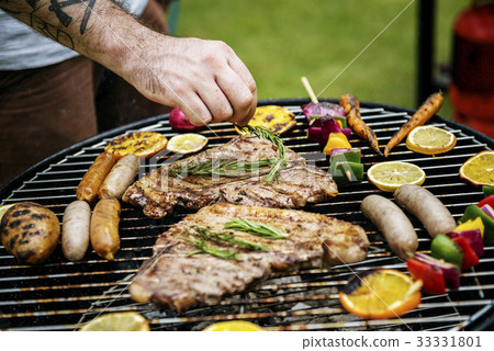 Closeup of barbecues steaks on the charcoals grill 33331801