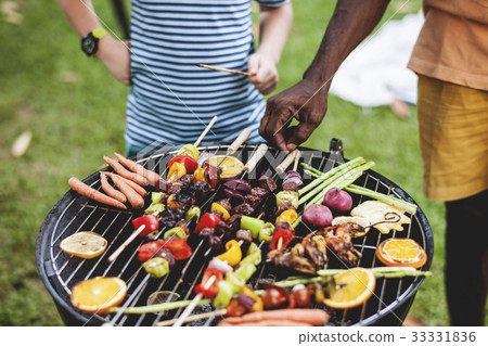 Diverse people enjoying barbecue party together 33331836