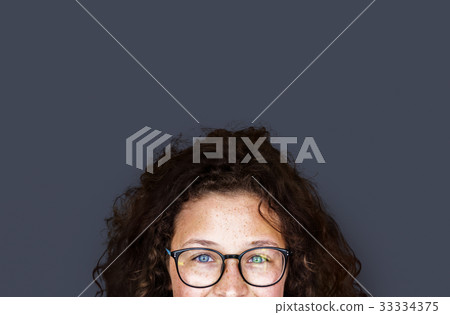 Portrait studio shoot of schoolgirl in uniform with smiling 33334375