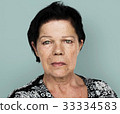 Senior adult woman in moody studio portrait 33334583