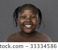 Little african girl smiling shirtless studio portrait 33334586