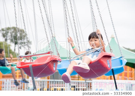 Girl riding a vehicle Girl riding a vehicle 33334900
