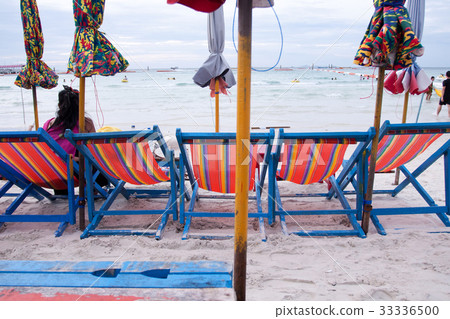 Beach chairs and umbrellas on the beach at Koh Lan Beach chairs and umbrellas on the beach at Koh Lan 33336500