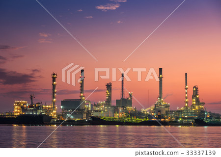 Oil refinery plant and loading dock at twilight. 33337139