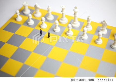 Business strategy, figures of two businessmen meeting each other on a chess board Business strategy, figures of two businessmen meeting each other on a chess board 33337155