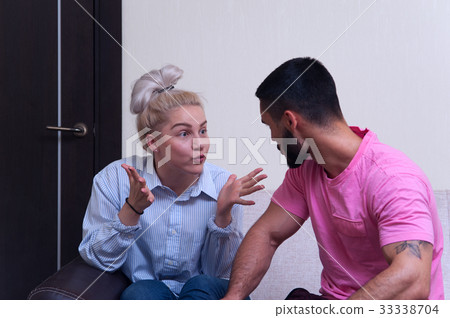 Portrait of angry couple shouting to each other 33338704
