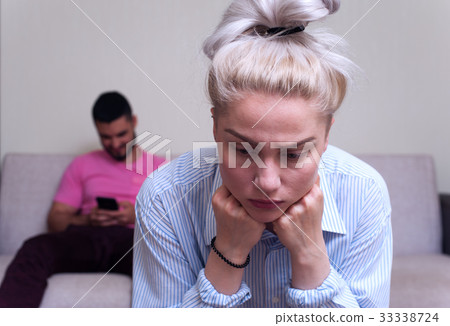 Young woman sitting separately with her boyfriend 33338724