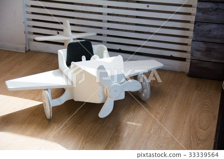 Wooden toy airplane on a wooden floor Wooden toy airplane on a wooden floor 33339564