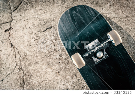 Skateboard on concrete floor in skatepark Skateboard on concrete floor in skatepark 33340155
