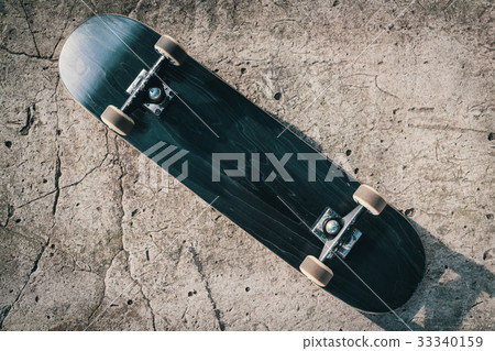 Skateboard on concrete floor in skatepark Skateboard on concrete floor in skatepark 33340159