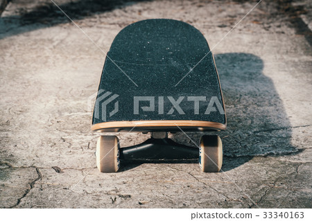 Skateboard on concrete floor in skatepark Skateboard on concrete floor in skatepark 33340163