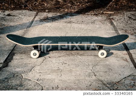 Skateboard on concrete floor in skatepark Skateboard on concrete floor in skatepark 33340165