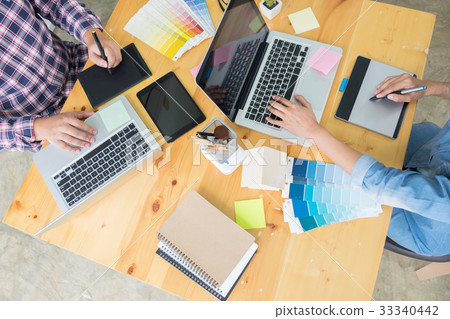 Graphic design partners working together renovation and technolo Graphic design partners working together renovation and technolo 33340442