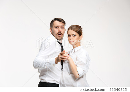 Successful business couple at the office looking Successful business couple at the office looking 33340825