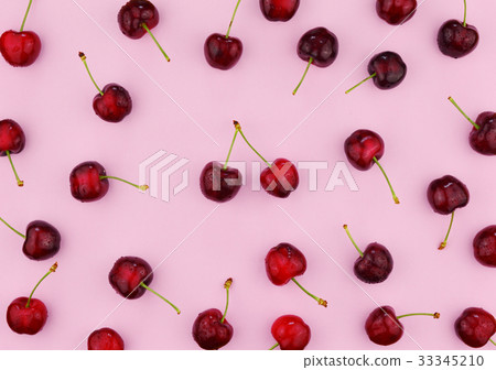 Ripe sweet cherries on pink background. 33345210