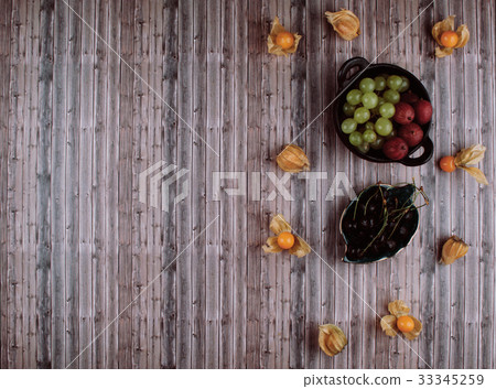 Organic physalis, green grapes and gooseberries. 33345259